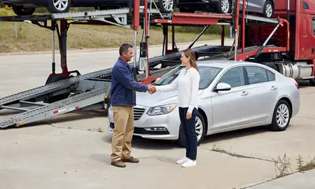 Vehicle owner beside their delivered car in Brunswick, Georgia, United States
