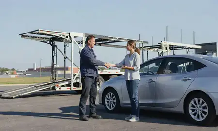 Vehicle owner beside their delivered car in Columbus, Georgia, United States