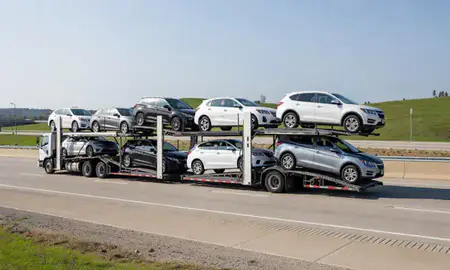 Multi-level car carrier on the highway to Dalton, Georgia, United States