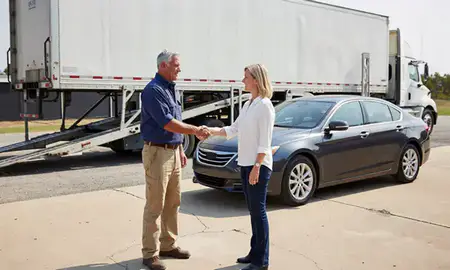 Vehicle owner beside their delivered car in Dalton, Georgia, United States