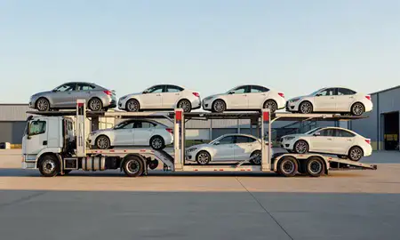Car transporter parked in an industrial area of Dalton, Georgia, United States