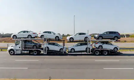 Multi-level car carrier on the highway to East Point, Georgia, United States