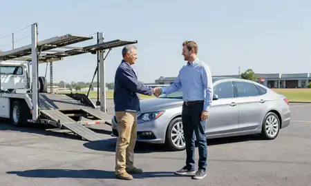 Vehicle owner beside their delivered car in Gainesville, Georgia, United States