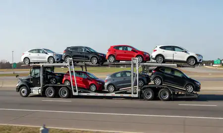 Multi-level car carrier on the highway to Johns Creek, Georgia, United States