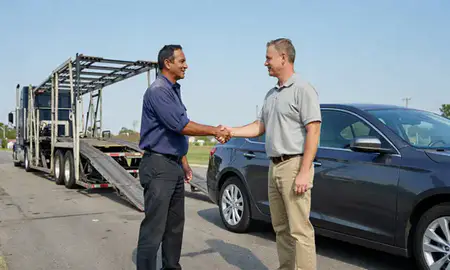 Vehicle owner beside their delivered car in Macon, Georgia, United States
