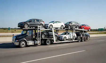 Multi-level car carrier on the highway to Milton, Georgia, United States