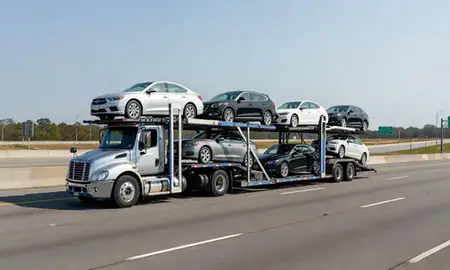 Multi-level car carrier on the highway to Newnan, Georgia, United States