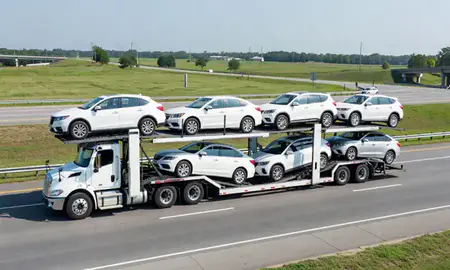 Multi-level car carrier on the highway to Peachtree City, Georgia, United States