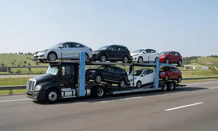 Multi-level car carrier on the highway to Rome, Georgia, United States