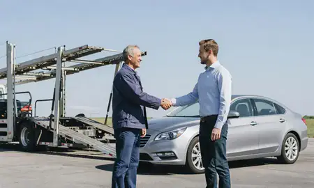 Vehicle owner beside their delivered car in Roswell, Georgia, United States