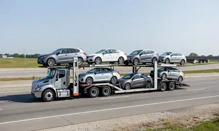 Multi-level car carrier on the highway to South Fulton, Georgia, United States