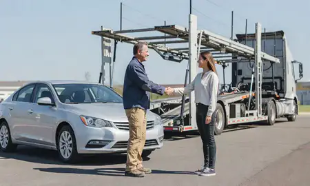 Vehicle owner beside their delivered car in Stonecrest, Georgia, United States