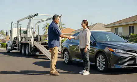 Vehicle owner beside their delivered car in Ewa Beach, Hawaii, United States