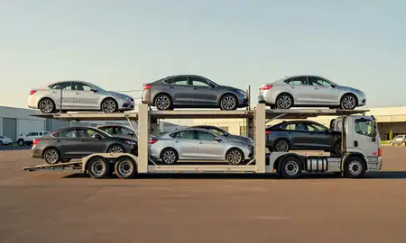 Car transporter parked in an industrial area of Hilo, Hawaii, United States
