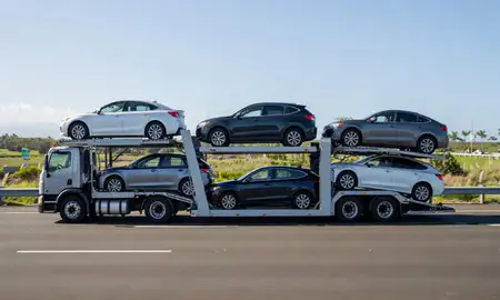 Multi-level car carrier on the highway to Kaneohe, Hawaii, United States