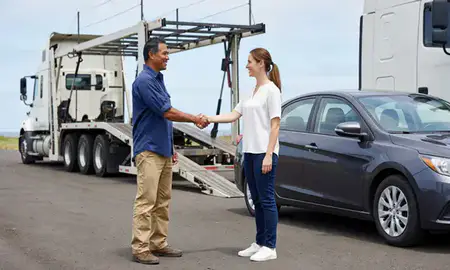 Vehicle owner beside their delivered car in Maili, Hawaii, United States