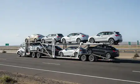 Multi-level car carrier on the highway to Nanakuli, Hawaii, United States
