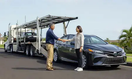 Vehicle owner beside their delivered car in Nanakuli, Hawaii, United States