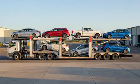 Car transporter parked in an industrial area of Ocean Pointe, Hawaii, United States