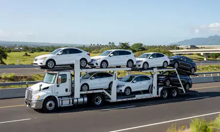 Multi-level car carrier on the highway to Pearl City, Hawaii, United States