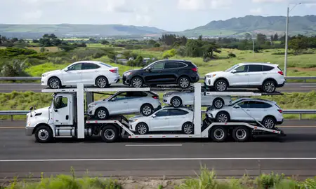Multi-level car carrier on the highway to Schofield Barracks, Hawaii, United States