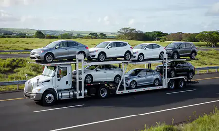 Multi-level car carrier on the highway to Wahiawa, Hawaii, United States