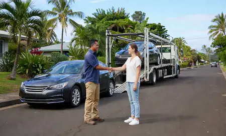 Vehicle owner beside their delivered car in Wahiawa, Hawaii, United States