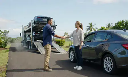 Vehicle owner beside their delivered car in Waihee-Waiehu, Hawaii, United States