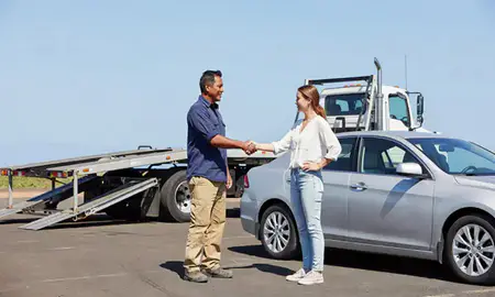 Vehicle owner beside their delivered car in Wailuku, Hawaii, United States