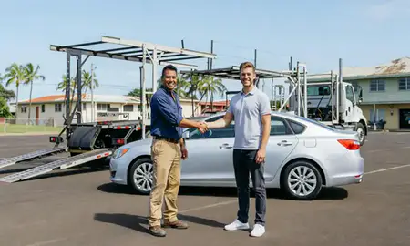Vehicle owner beside their delivered car in Waipahu, Hawaii, United States