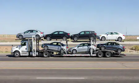 Multi-level car carrier on the highway to Blackfoot, Idaho, United States