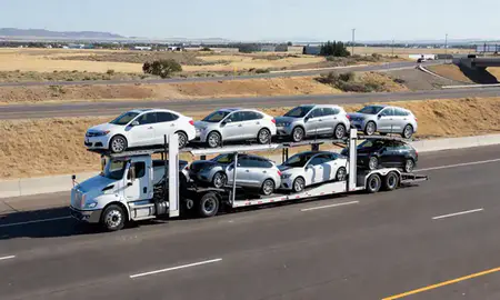 Multi-level car carrier on the highway to Boise, Idaho, United States