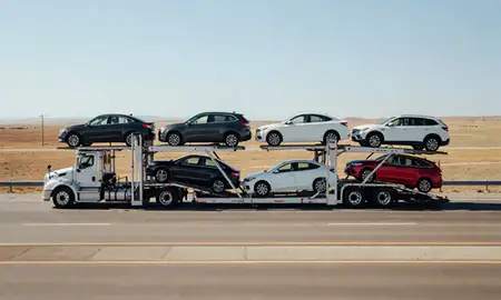 Multi-level car carrier on the highway to Burley, Idaho, United States