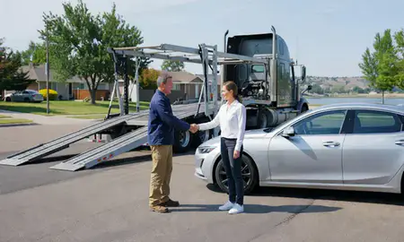 Vehicle owner beside their delivered car in Garden City, Idaho, United States