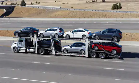 Multi-level car carrier on the highway to Hayden, Idaho, United States