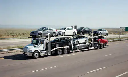 Multi-level car carrier on the highway to Idaho Falls, Idaho, United States