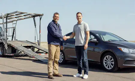 Vehicle owner beside their delivered car in Kuna, Idaho, United States