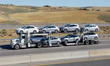Multi-level car carrier on the highway to Lewiston, Idaho, United States