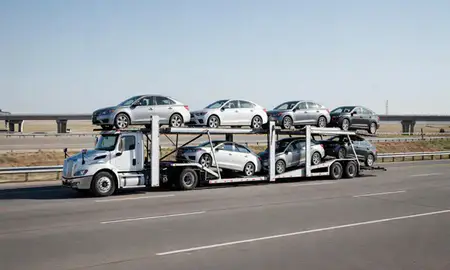 Multi-level car carrier on the highway to Meridian, Idaho, United States