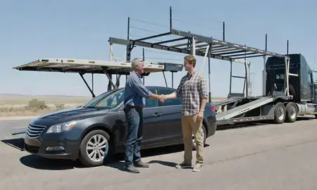 Vehicle owner beside their delivered car in Mountain Home, Idaho, United States