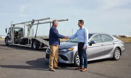 Vehicle owner beside their delivered car in Nampa, Idaho, United States