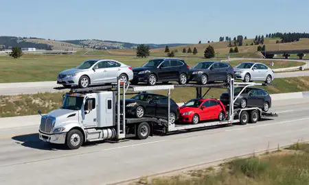 Multi-level car carrier on the highway to Post Falls, Idaho, United States