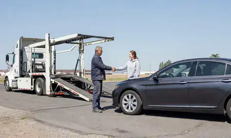 Vehicle owner beside their delivered car in Post Falls, Idaho, United States