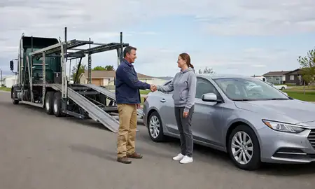 Vehicle owner beside their delivered car in Rathdrum, Idaho, United States