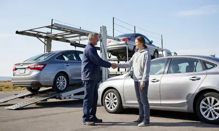 Vehicle owner beside their delivered car in Rexburg, Idaho, United States