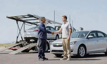 Vehicle owner beside their delivered car in Twin Falls, Idaho, United States