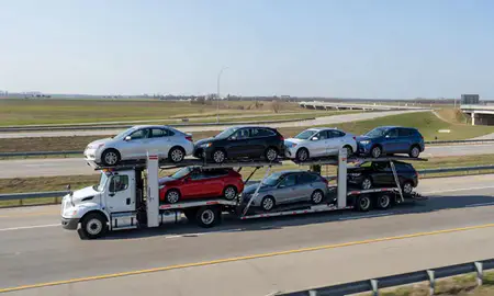 Multi-level car carrier on the highway to Bloomington, Illinois, United States