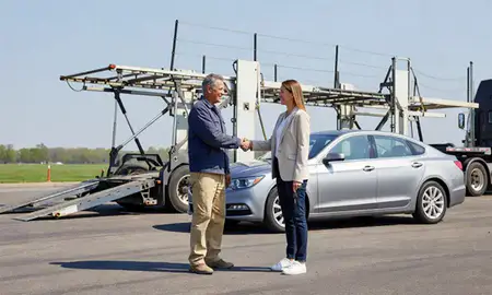 Vehicle owner beside their delivered car in Bolingbrook, Illinois, United States