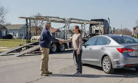 Vehicle owner beside their delivered car in Cicero, Illinois, United States