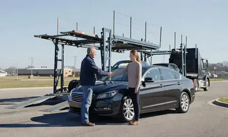 Vehicle owner beside their delivered car in Elgin, Illinois, United States